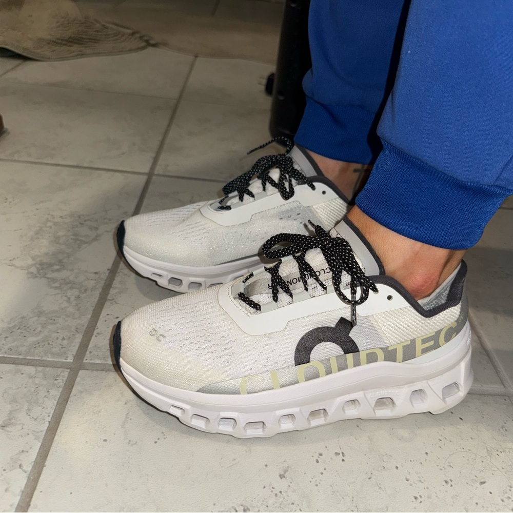 On Running White and Black Athletic Shoes